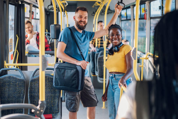 istock Multiracial friends talking while riding a bus in the city 1417616809