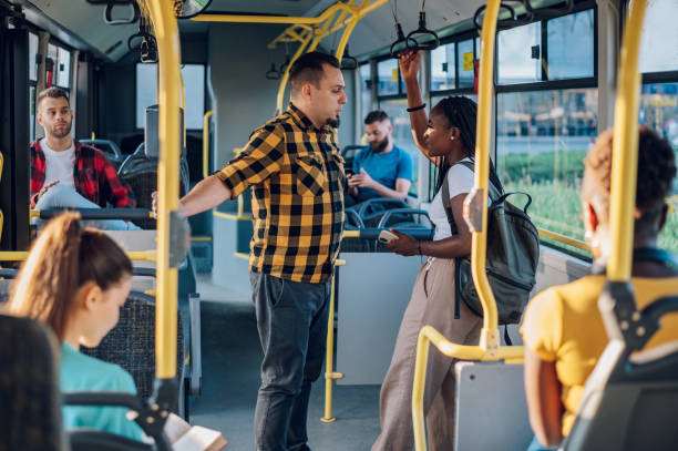 istock Multiracial friends talking while riding a bus in the city 1417616812