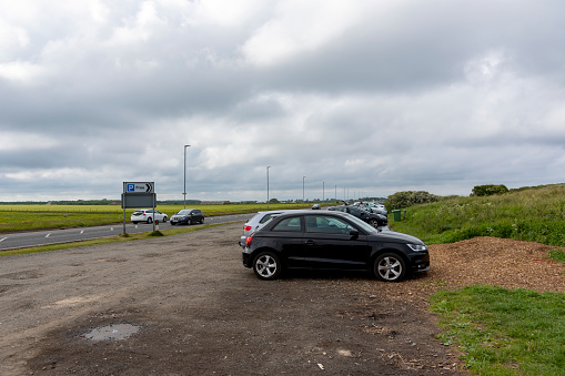 Seaton Sluice Beach car park with the A193 in the background. Seaton Sluice, Northumberland, England, UK.