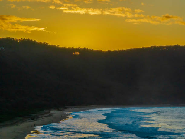 istock Aerial sunrise at the beach with clouds 1417619363