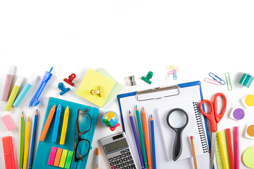 Set of school supplies and crayons on white background