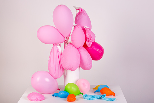 limp balloons, symbolic of failure and powerlessness
