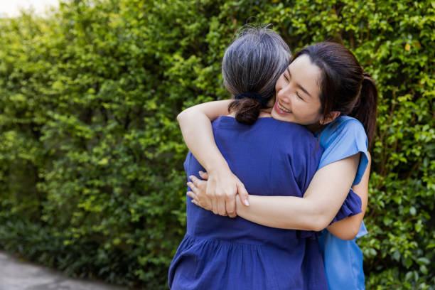 istock Grandmother embracing her daughter. 1417621299
