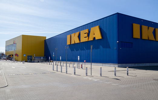 Krakow, Poland - March 27, 2022: IKEA Store in Kraków. Home furnishing retail shop. Exterior with brand logo sign, Swedish multinational company logotype.