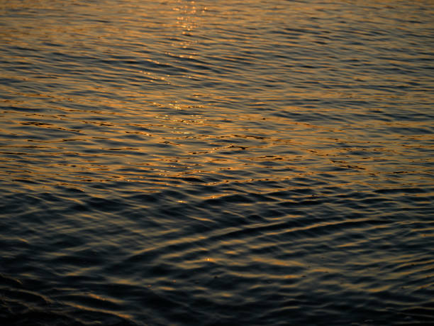 istock beautiful sea waves at sunset 1417627238