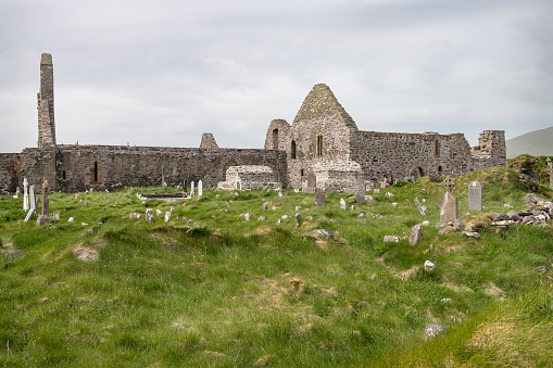 Graves in Ballinskelligs Abbey graveyard on the Iveragh peninsula, County Kerry, Ireland