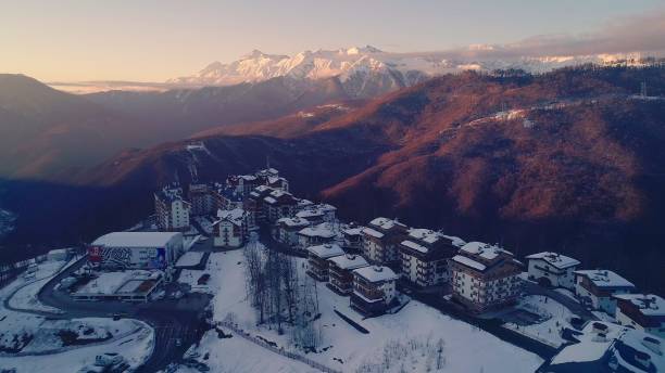 Sunrize, morning aerial view of the Olympic mountain village Roza Plato Sunrize, morning aerial view of the Olympic mountain village Roza Plato. krasnodar krai stock pictures, royalty-free photos & images