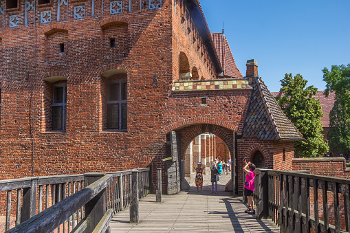 Wooden bridge and entrance gate of the castle in Malbork, Poland