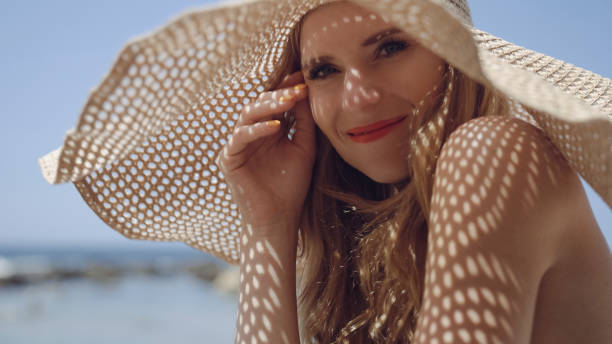 istock Smilling woman in a straw hat on vacation 1417632479