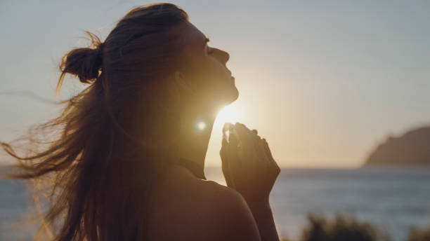 istock Woman holding a crystal at sunset. Healing Crystals 1417632565