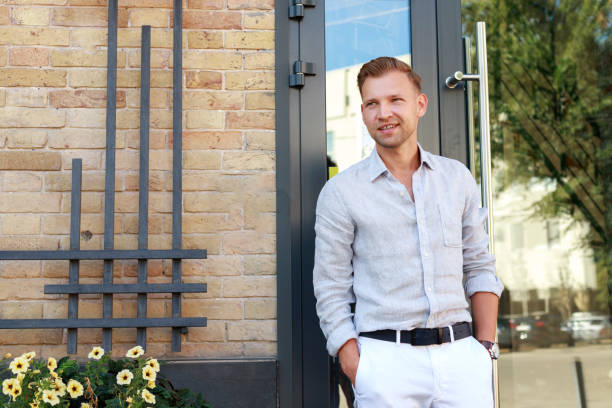 istock portrait optimistic positive man near the building 1417635455