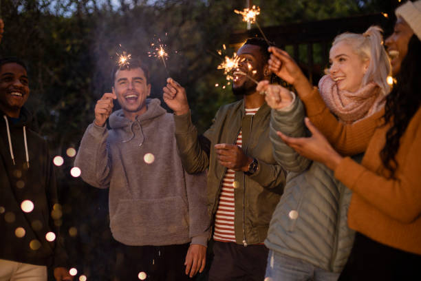 istock Laughing With Each Other Holding Sparklers 1417640512