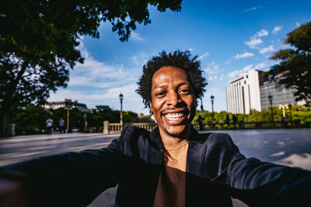 istock Young Man Taking Selfies In The Park 1417640794