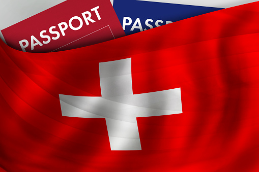 Swiss flag background and passport of Switzerland. Citizenship, official legal immigration, visa, business and travel concept.