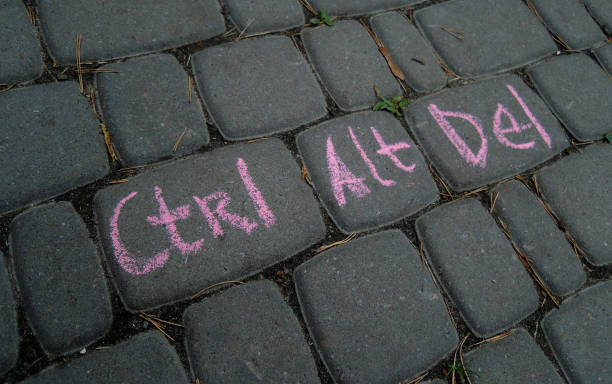 istock Contral, Alt, Delete Words Combination Written By Red Chalk On A Gray Paving Like On A Computer Keyboard 1417646663