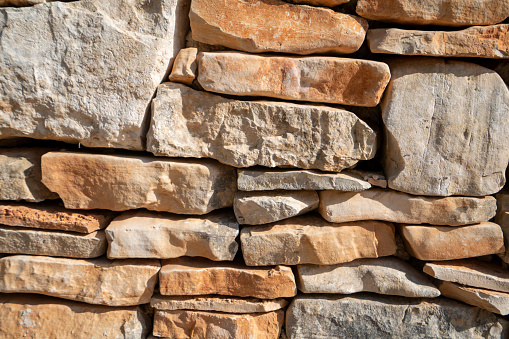 Stone wall near road in small Istrian place Peroj, Croatian coast. This are the local rocks mostly from backyards and fields nice for backgrounds.