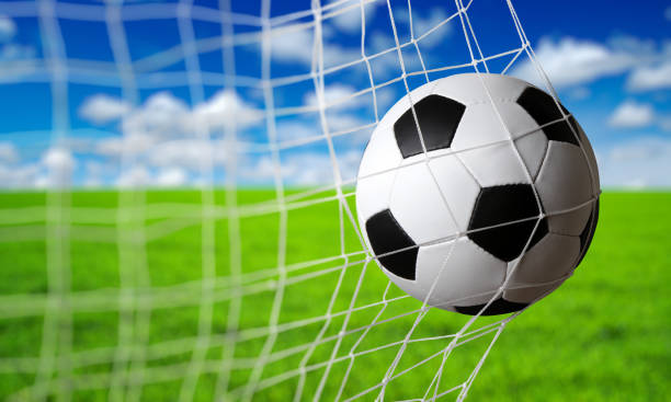 istock Soccer ball in the net 1417647973