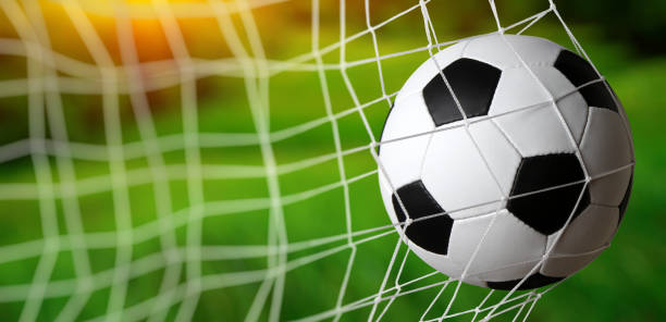 istock Soccer ball in the net 1417647977