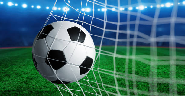 istock Soccer ball in the net 1417648003