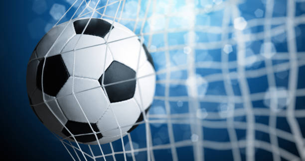 istock Soccer ball in the net 1417648013