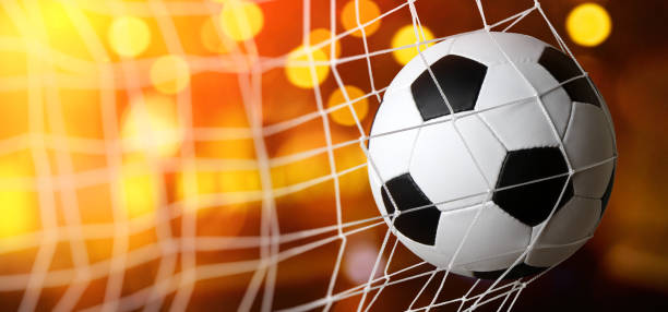 istock Soccer ball in the net 1417648027