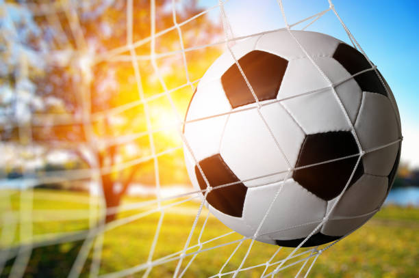 istock Soccer ball in the net 1417648054