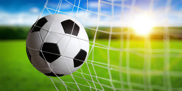 istock Soccer ball in the net 1417648060