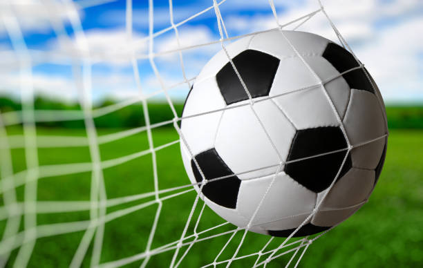 istock Soccer ball in the net 1417648103