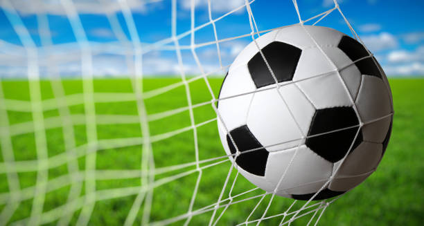 istock Soccer ball in the net 1417648113