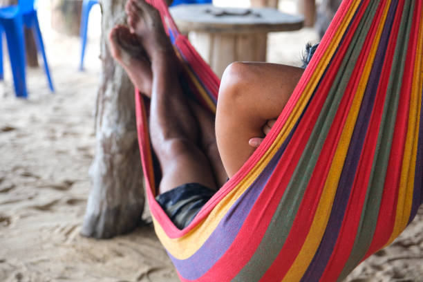 istock A Local Thai Man is Resting in His Colorful Hammock During a Work Break 1417648300