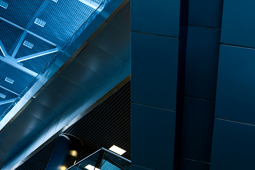 Abstract, futuristic background from metal structures of the interior of the building.