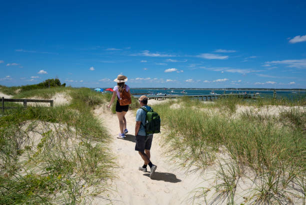 Couple hiking on the beach.