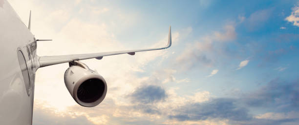 istock White airplane flying above cloud close up 1417649950
