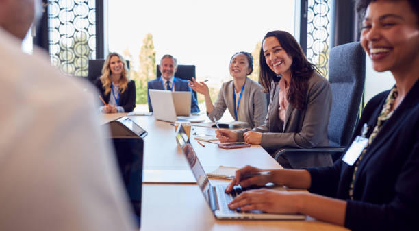 istock Multi-Cultural Business Team Meeting And Collaborating Around Table In Modern Office Building 1417650148