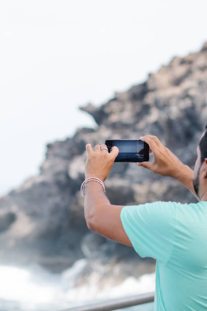 istock handsome young man using his smartphone in city 1417650648