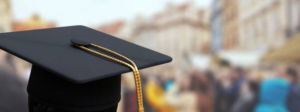 College, school Graduation. Student cap, mortarboard hat with gold tassel stock photo