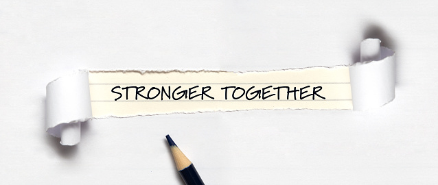 Stronger together written under torn paper.