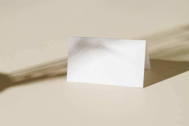 istock Blank paper mockup card with sunlight shadows, boho minimal style 1417662711