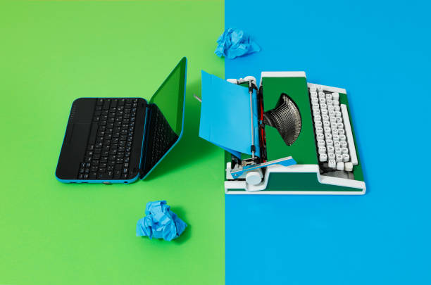 istock Digital und analog – Laptop and 70s Typewriter 1417663132
