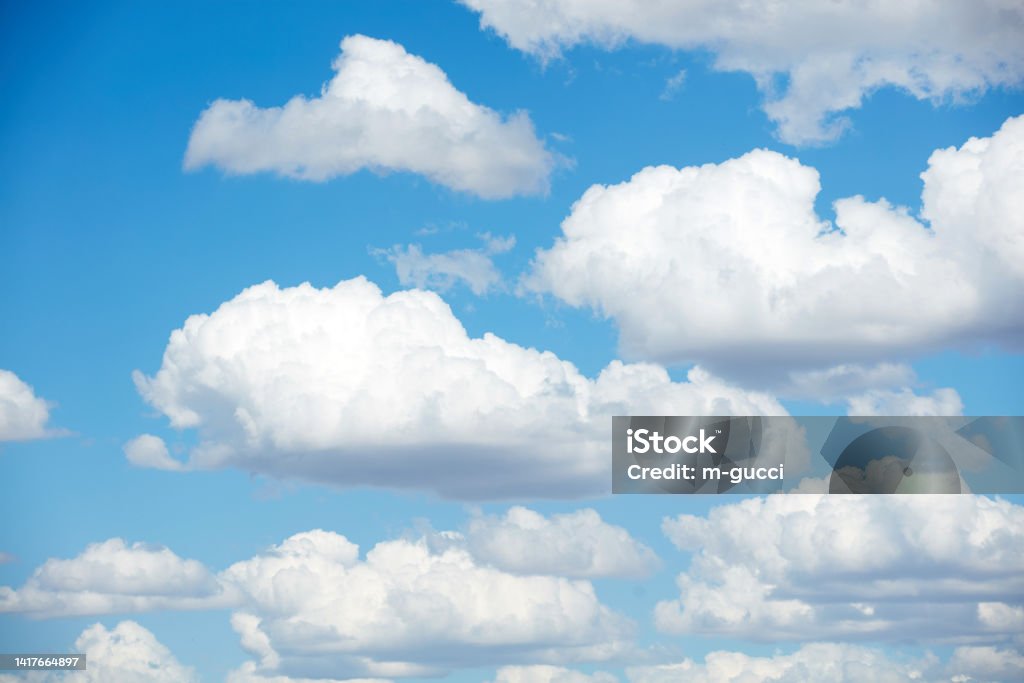 Blue skies with summer cumulus clouds. Cumulus Cloud Stock Photo