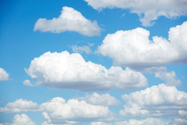 Blue skies with summer cumulus clouds. stock photo