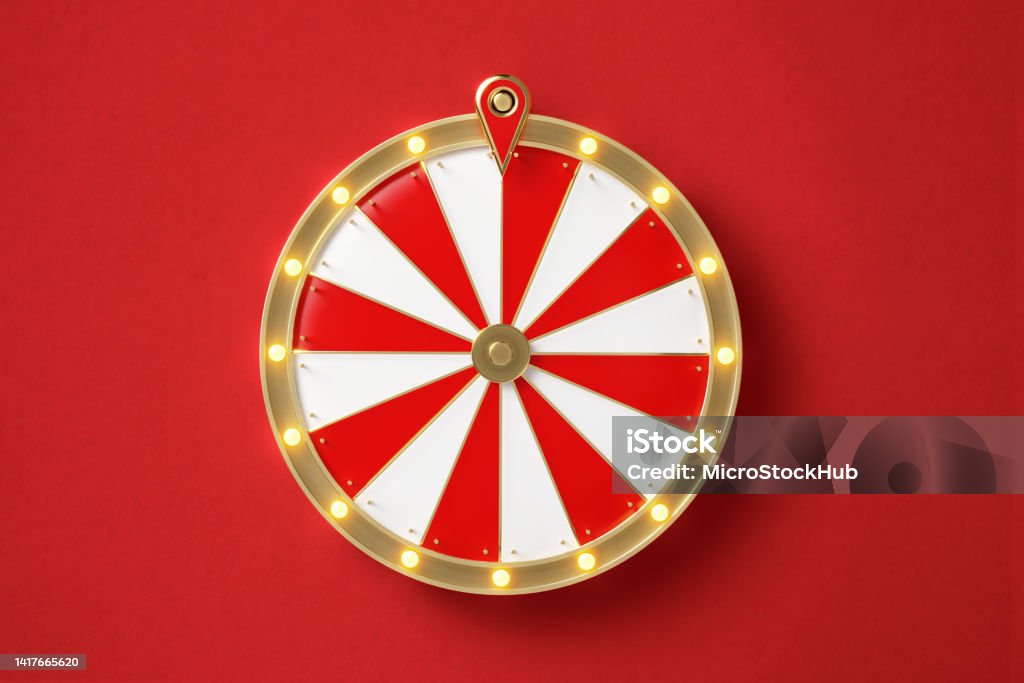 Wheel Of Fortune On Red Background Wheel of fortune on red background. Horizontal composition with copy space. Directly above. Wheel Stock Photo
