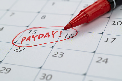 Calendar with red marked payday