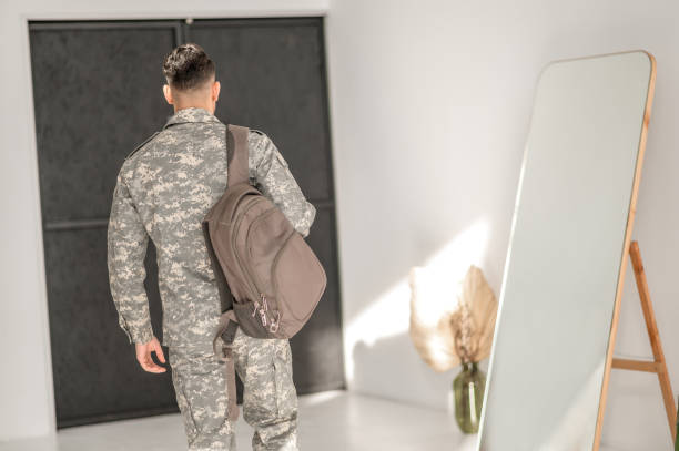 istock Soldier in the camouflage uniform leaving his home 1417666534
