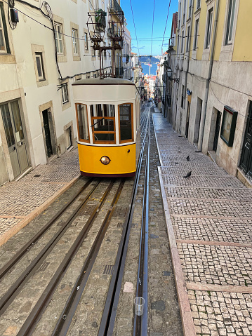 Historic cable car da Bica is a 19th-century cable railway with 2 small cars riding up & down a quaint street with a sharp incline