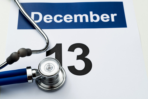 Stethoscope and pen on a calendar