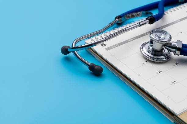istock Stethoscope and pen on a calendar 1417670591