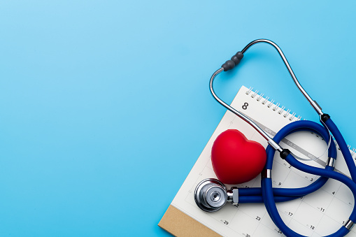 Stethoscope and heart shape on a calendar