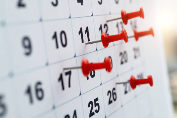 istock Thumbtack pins on a calendar 1417671020