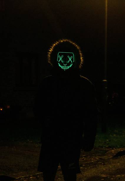 istock Man with a scary mask at night 1417672652